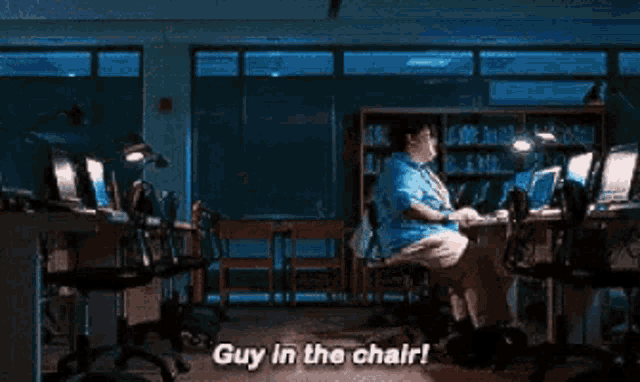 Ned from Spider-Man: Homecoming spinning happily in his chair, captioned "guy in the chair"